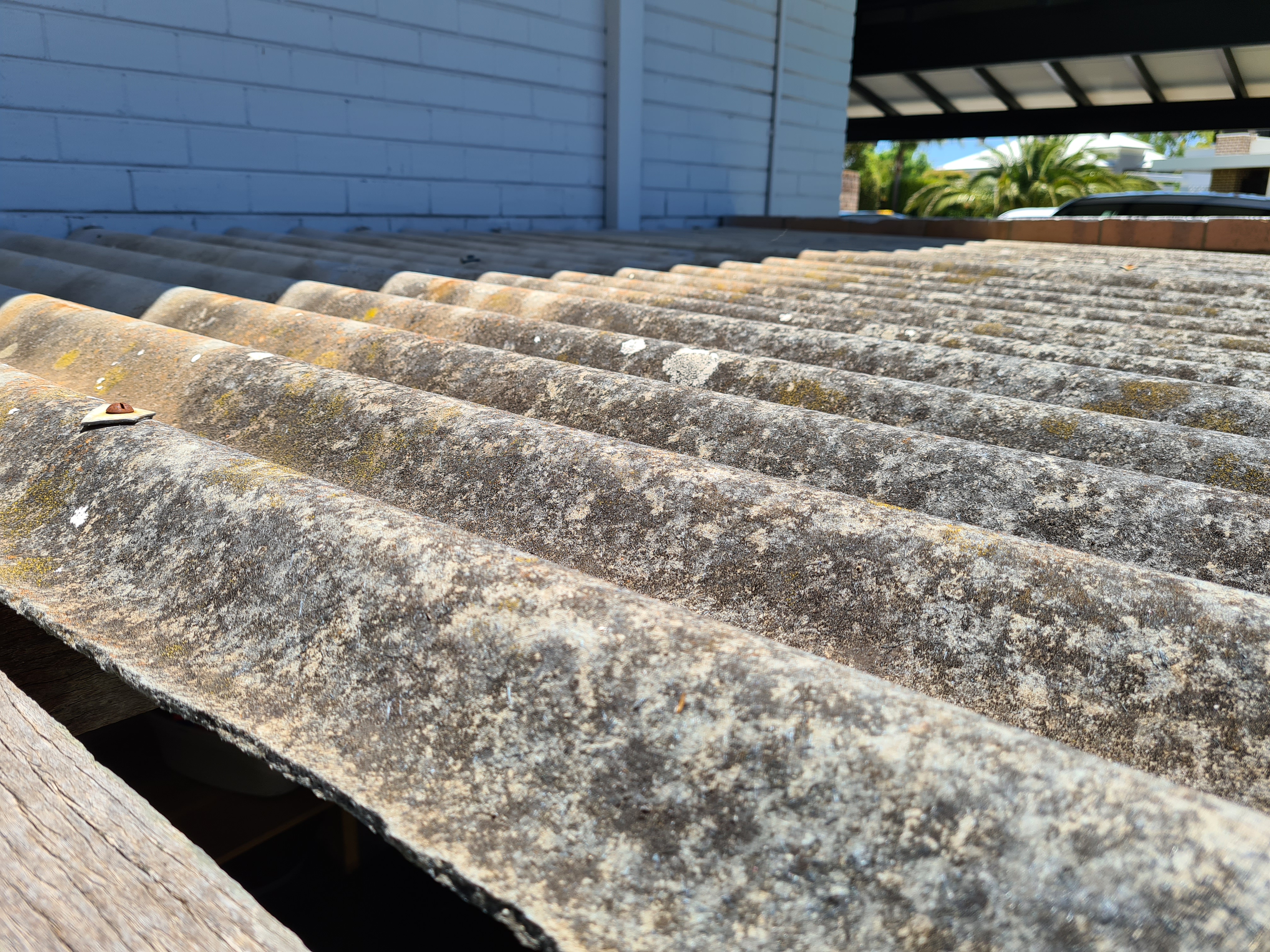 SURE inspection photo showing weathered roof tiles and roof-covering condition