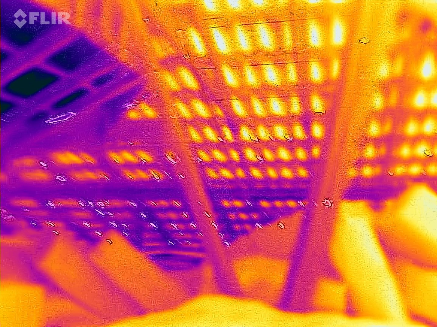 SURE inspector capturing a wall thermal image on a FLIR phone