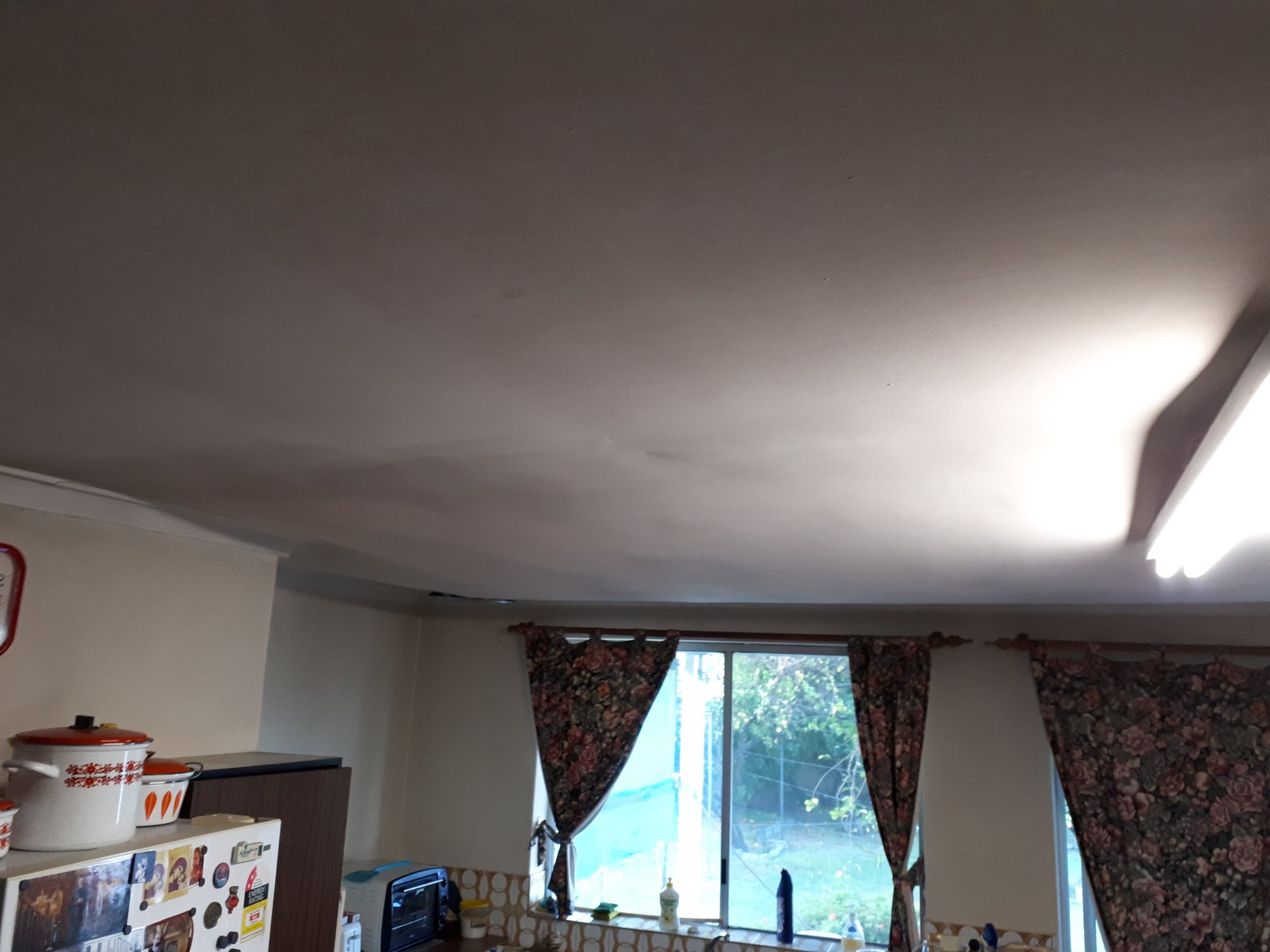 Sagging, water-stained kitchen ceiling identified during a SURE inspection