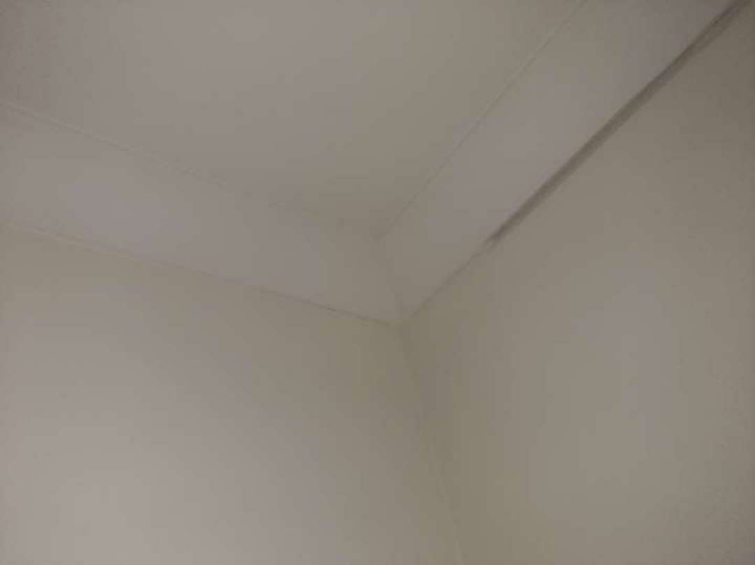 Drummy Floor Tiles — real finishes defect photographed in a SURE Building Inspections report