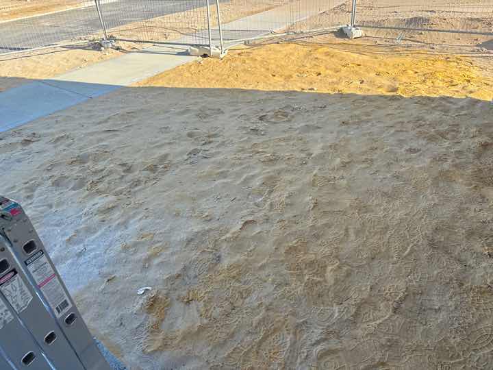 Turf Not Installed — real compliance defect photographed in a SURE Building Inspections report