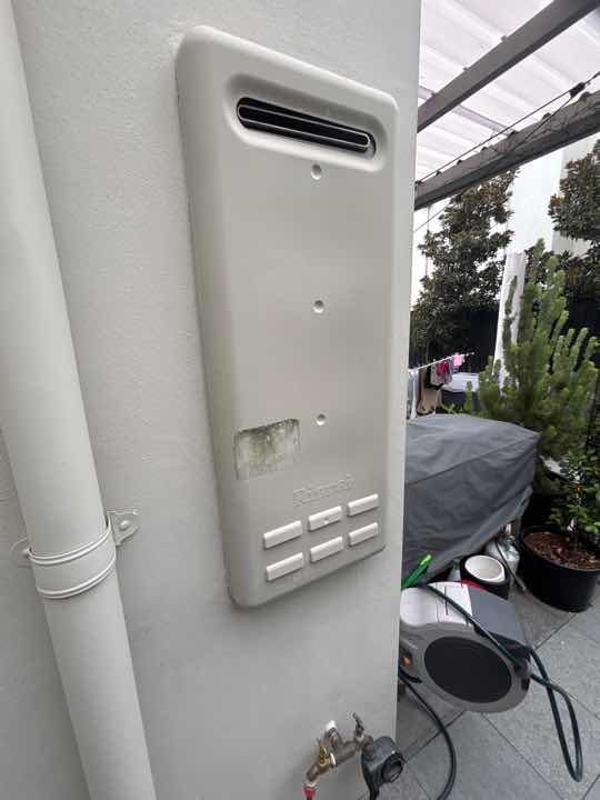 Undrained Air Conditioning Overflow — real moisture defect photographed in a SURE Building Inspections report