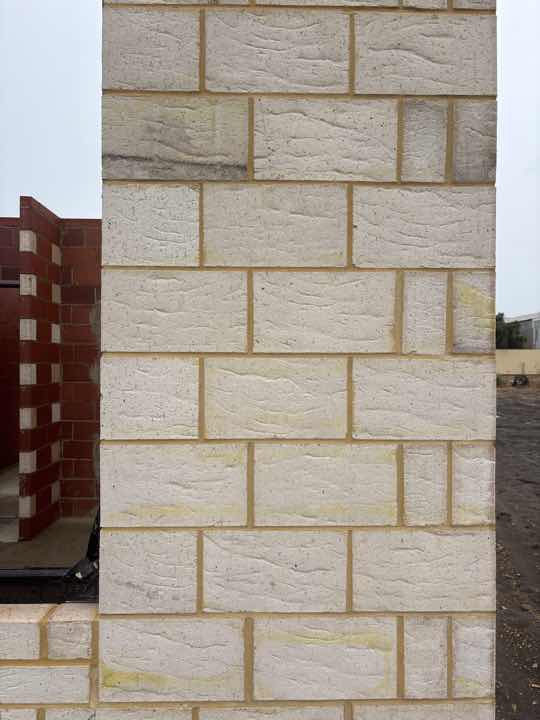 Poorly Finished Mortar Joints on North Wall — real finishes defect photographed in a SURE Building Inspections report