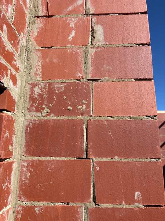 Poorly Finished Mortar Joints on North Wall — real finishes defect photographed in a SURE Building Inspections report