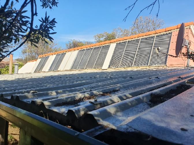Aged Roof Cladding and Deteriorated Flashing — real compliance defect photographed in a SURE Building Inspections report