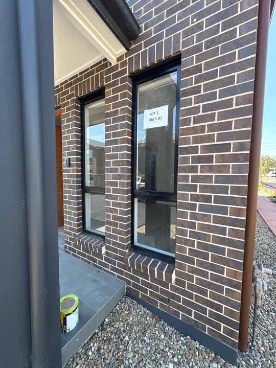 Gaps between Window Frame and Wall Cladding — real moisture defect photographed in a SURE Building Inspections report