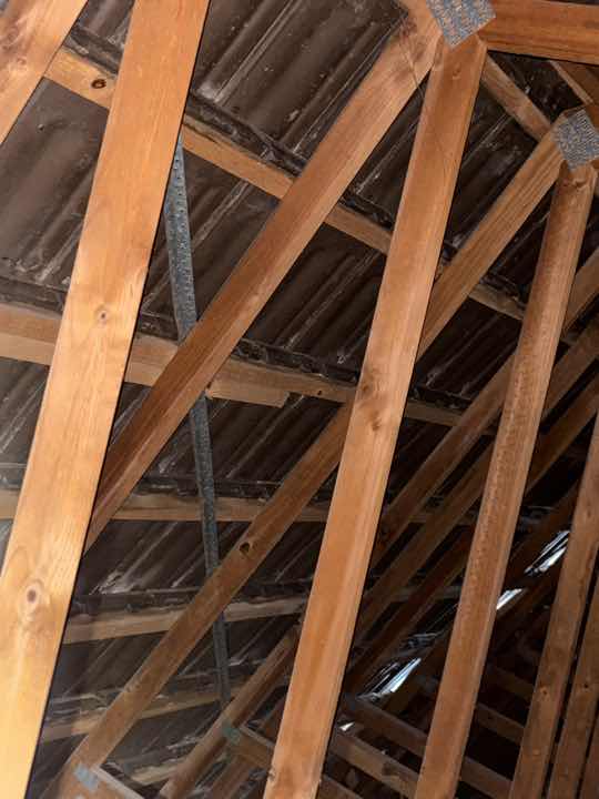 Roof Void Obstruction by Insulation — real termite defect photographed in a SURE Building Inspections report