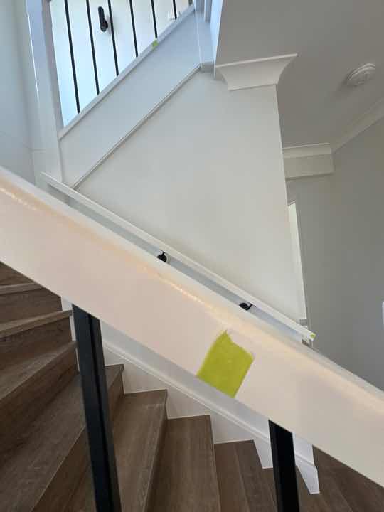 Paint Touch Ups Required — real finishes defect photographed in a SURE Building Inspections report