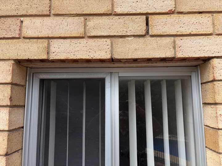 Lintel Rust Above External Window — real structural defect photographed in a SURE Building Inspections report