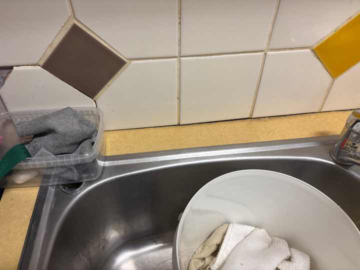 Sealant Deterioration at Splashback — real finishes defect photographed in a SURE Building Inspections report