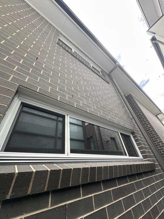 Gaps between Window Frame and Wall Cladding — real moisture defect photographed in a SURE Building Inspections report