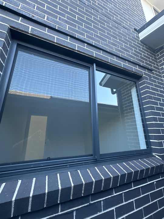 Gaps between Window Frame and Wall Cladding — real moisture defect photographed in a SURE Building Inspections report