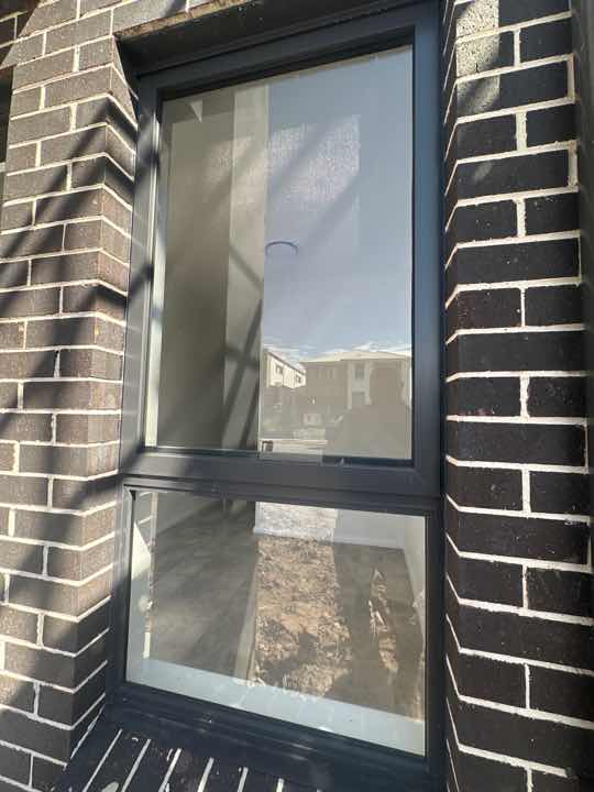 Gaps between Window Frame and Wall Cladding — real moisture defect photographed in a SURE Building Inspections report