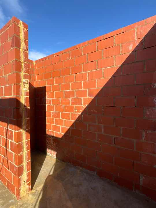 Poorly Finished Mortar Joints on North Wall — real finishes defect photographed in a SURE Building Inspections report