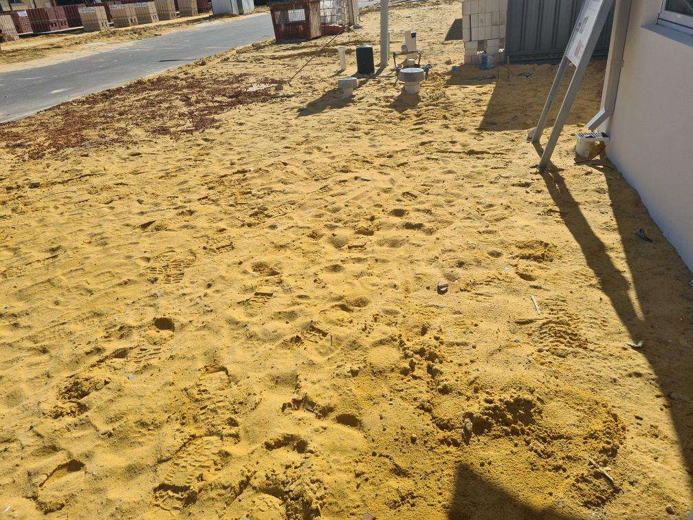 Uncompleted Landscaping — real finishes defect photographed in a SURE Building Inspections report