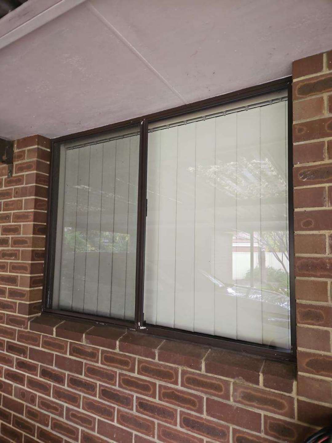 Detached Window Awning with Corrosion — real structural defect photographed in a SURE Building Inspections report