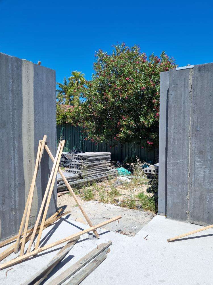 External Wall Panel Protruding from Plumb Line — real structural defect photographed in a SURE Building Inspections report