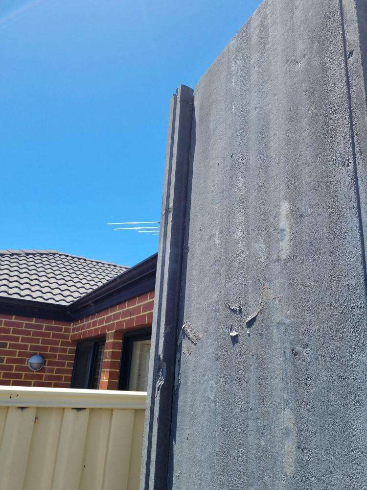 External Wall Panel Protruding from Plumb Line — real structural defect photographed in a SURE Building Inspections report