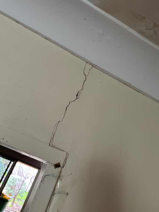 Ceiling Stains with No Current Moisture — real moisture defect photographed in a SURE Building Inspections report