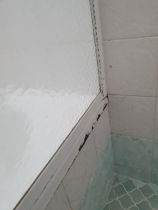 Deteriorating Bath Grout — real moisture defect photographed in a SURE Building Inspections report
