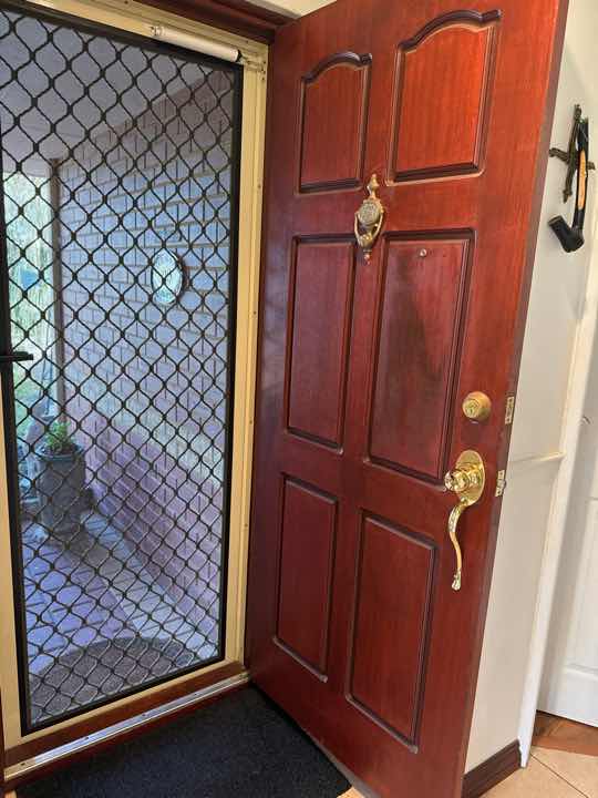 Binding Door (Hallways) — real structural defect photographed in a SURE Building Inspections report