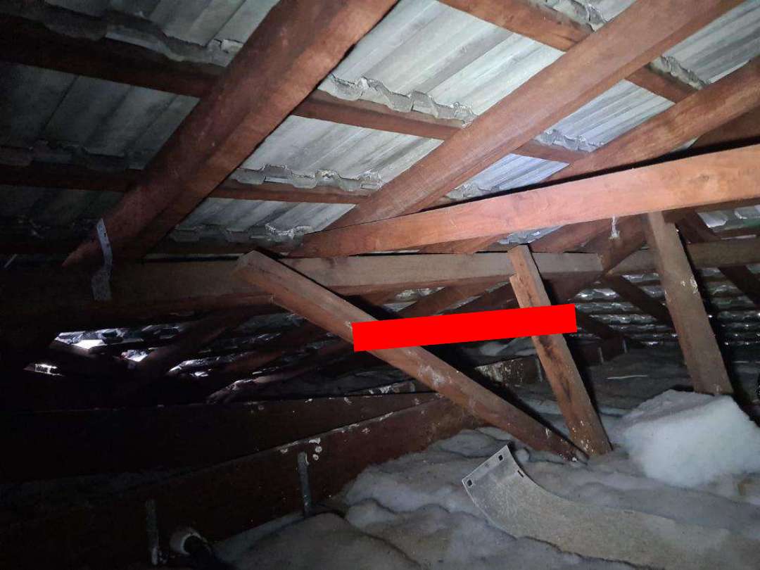 Missing Roof Bracing and Tiedowns — real structural defect photographed in a SURE Building Inspections report