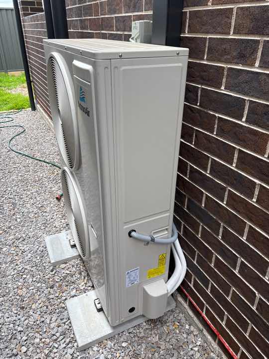 Air Conditioner Overflow Creating Conducive Conditions — real termite defect photographed in a SURE Building Inspections report