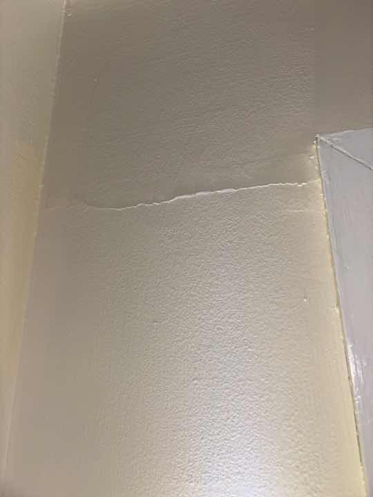 Uneven Floors Indicating Possible Movement/Settlement — real structural defect photographed in a SURE Building Inspections report