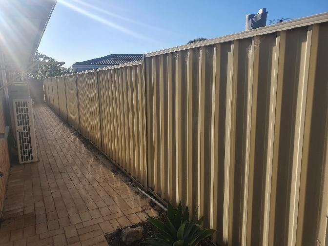 Leaning retaining wall — real structural defect photographed in a SURE Building Inspections report