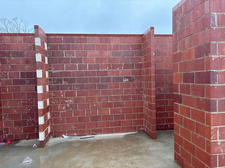 Poorly Finished Mortar Joints on North Wall — real finishes defect photographed in a SURE Building Inspections report