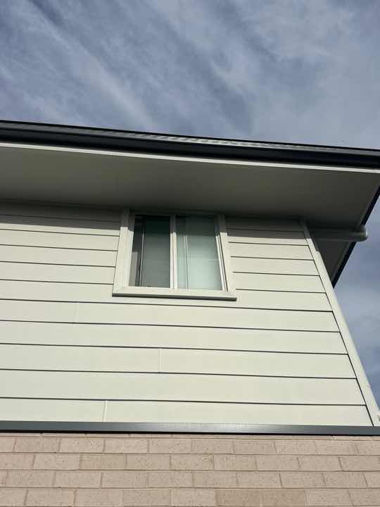 Gaps between Window Frame and Wall Cladding — real moisture defect photographed in a SURE Building Inspections report
