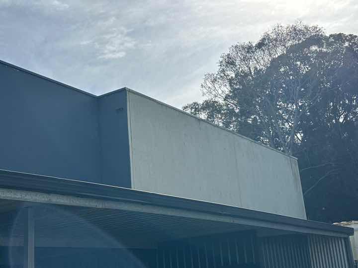 External Wall Render Deterioration — real finishes defect photographed in a SURE Building Inspections report