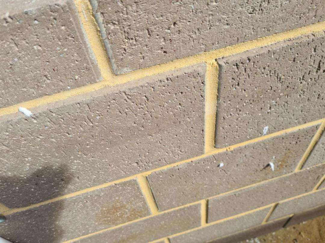 Incomplete Caulking Around Exterior Window Frame — real moisture defect photographed in a SURE Building Inspections report