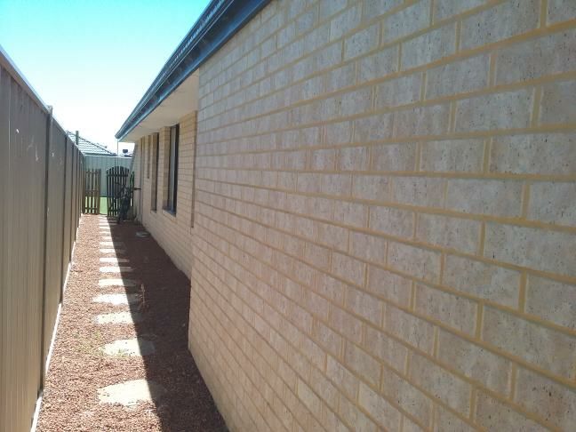 External Wall Render Deterioration — real finishes defect photographed in a SURE Building Inspections report