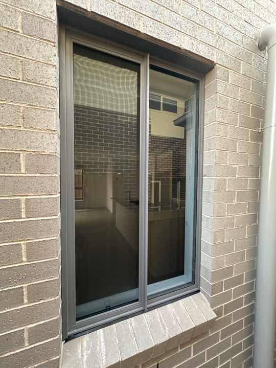 Gaps between Window Frame and Wall Cladding — real moisture defect photographed in a SURE Building Inspections report