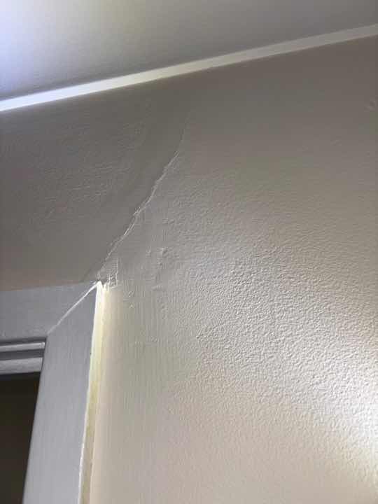 Uneven Floors Indicating Possible Movement/Settlement — real structural defect photographed in a SURE Building Inspections report