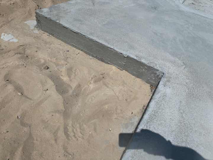 Incomplete Slab Edge Waterproofing — real moisture defect photographed in a SURE Building Inspections report