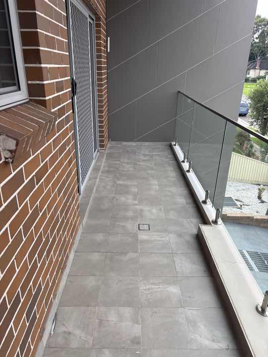 Cosmetic Cracks in Exterior Render — real finishes defect photographed in a SURE Building Inspections report