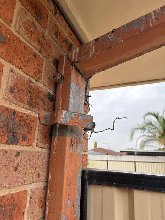 Excessive Moisture Readings — real moisture defect photographed in a SURE Building Inspections report
