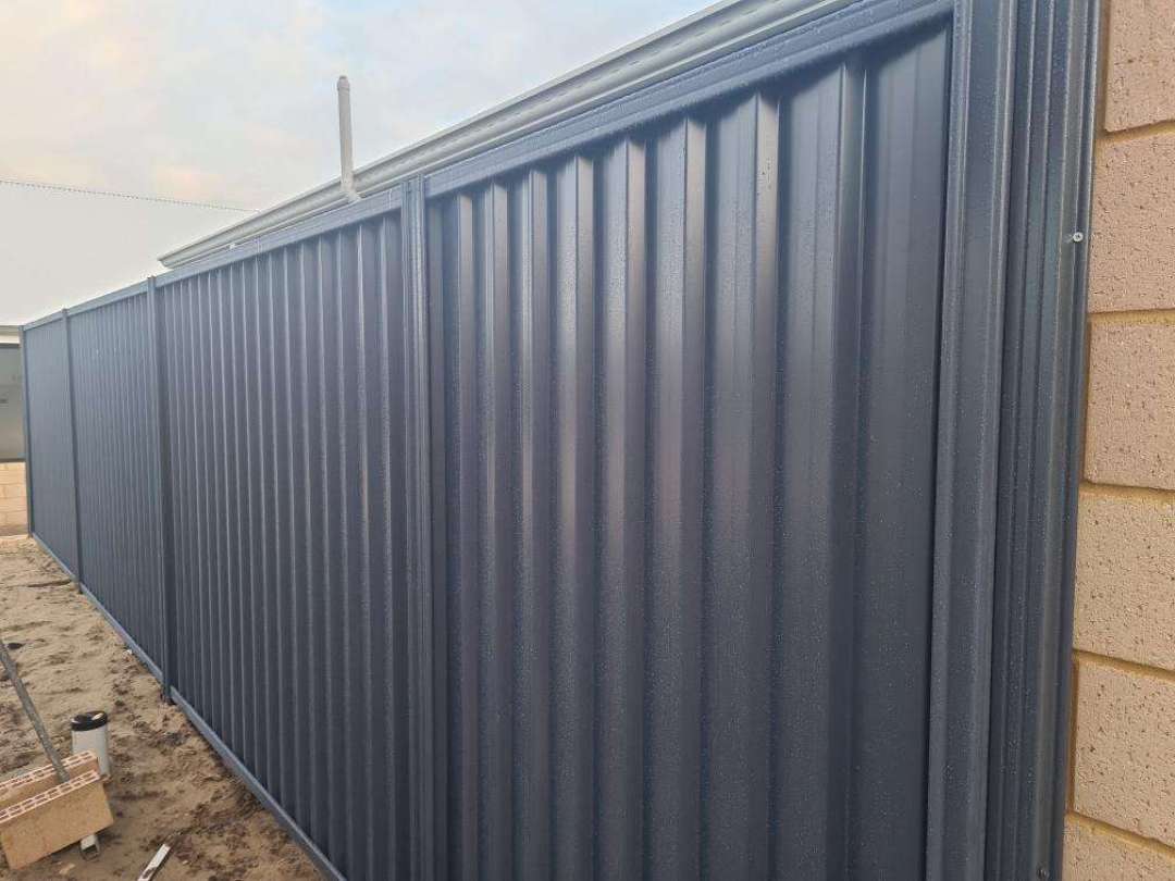 Unpainted Exterior Pipes — real finishes defect photographed in a SURE Building Inspections report