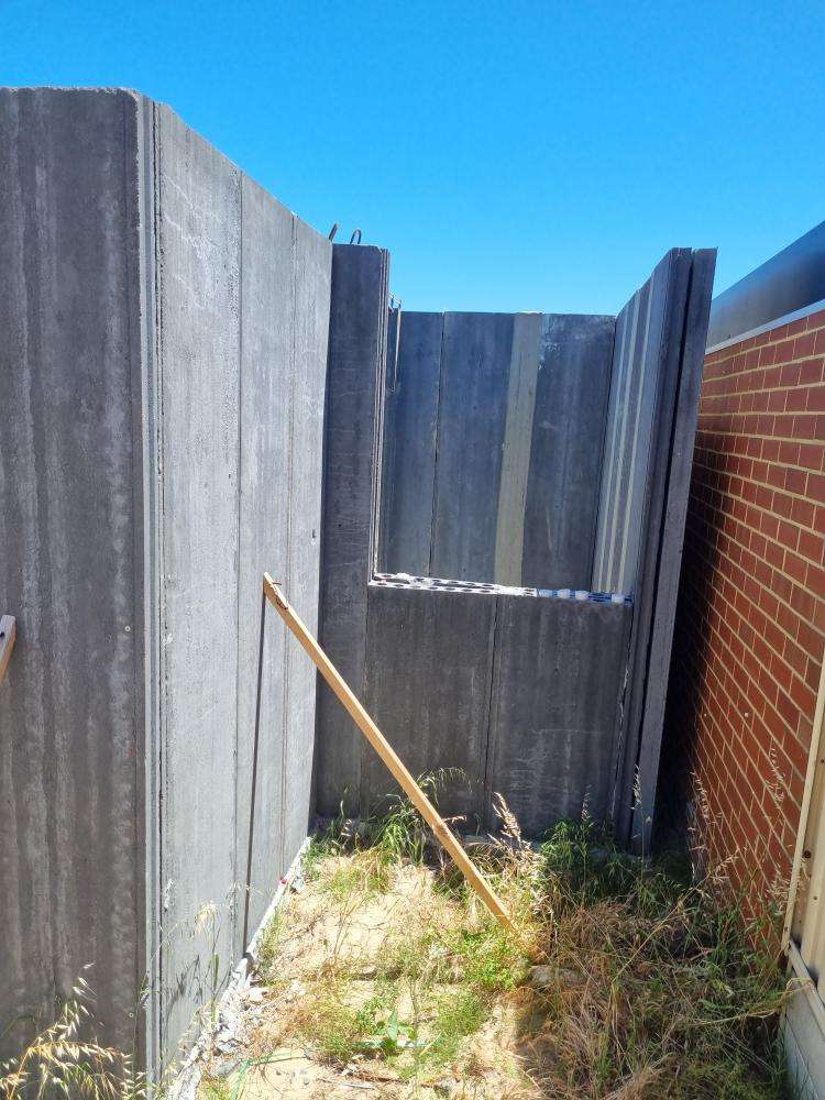 External Wall Panel Protruding from Plumb Line — real structural defect photographed in a SURE Building Inspections report