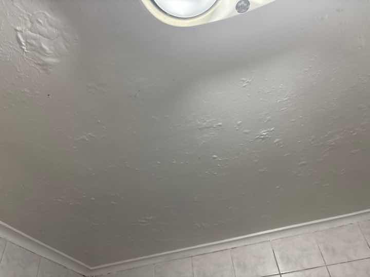 Shower Sealant Deterioration — real moisture defect photographed in a SURE Building Inspections report