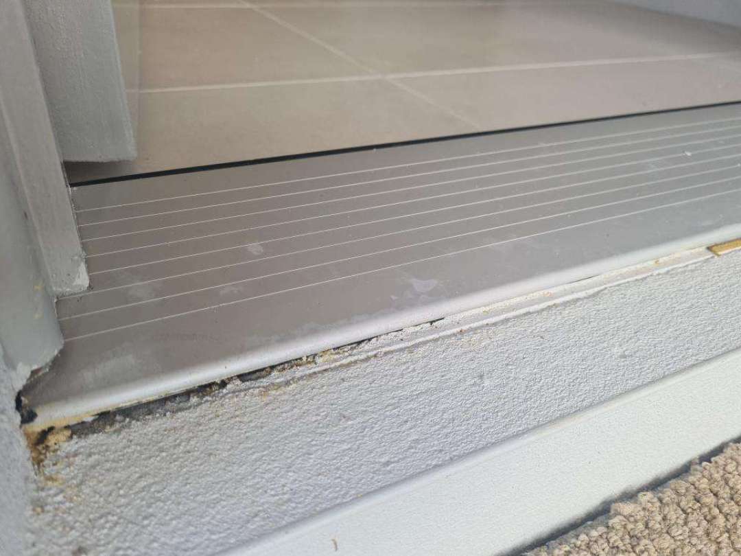 Unsealed Plumbing/Drains through Slabs — real termite defect photographed in a SURE Building Inspections report