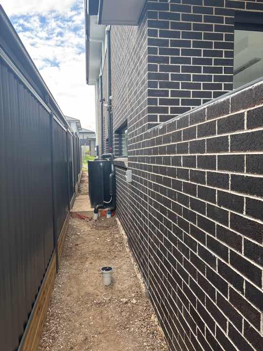 Exterior Walls Require Acid Clean — real finishes defect photographed in a SURE Building Inspections report