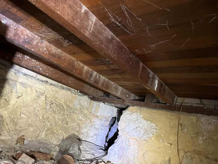 Debris in Subfloor — real compliance defect photographed in a SURE Building Inspections report