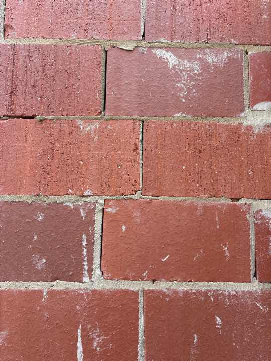 Damaged Bricks — real structural defect photographed in a SURE Building Inspections report