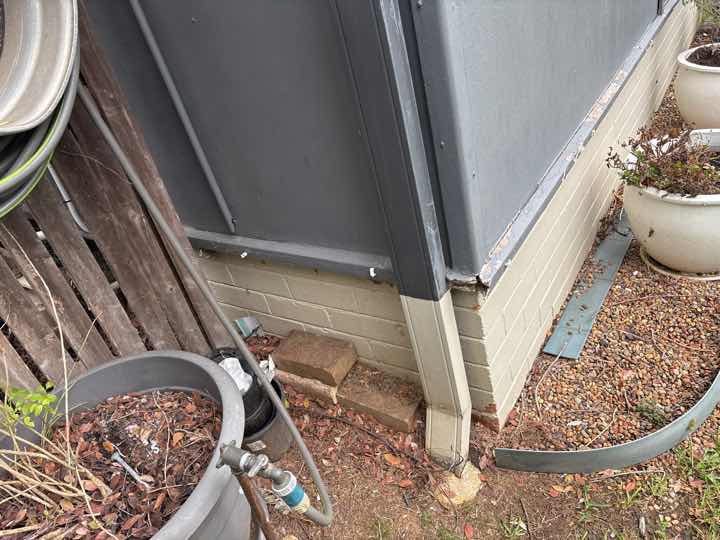 Restricted Subfloor Access — real structural defect photographed in a SURE Building Inspections report
