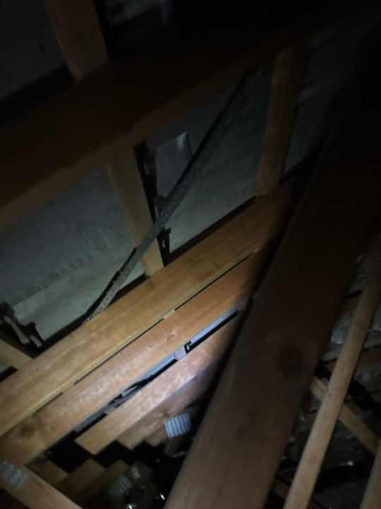 Obstructed Roof Void due to Insulation — real structural defect photographed in a SURE Building Inspections report