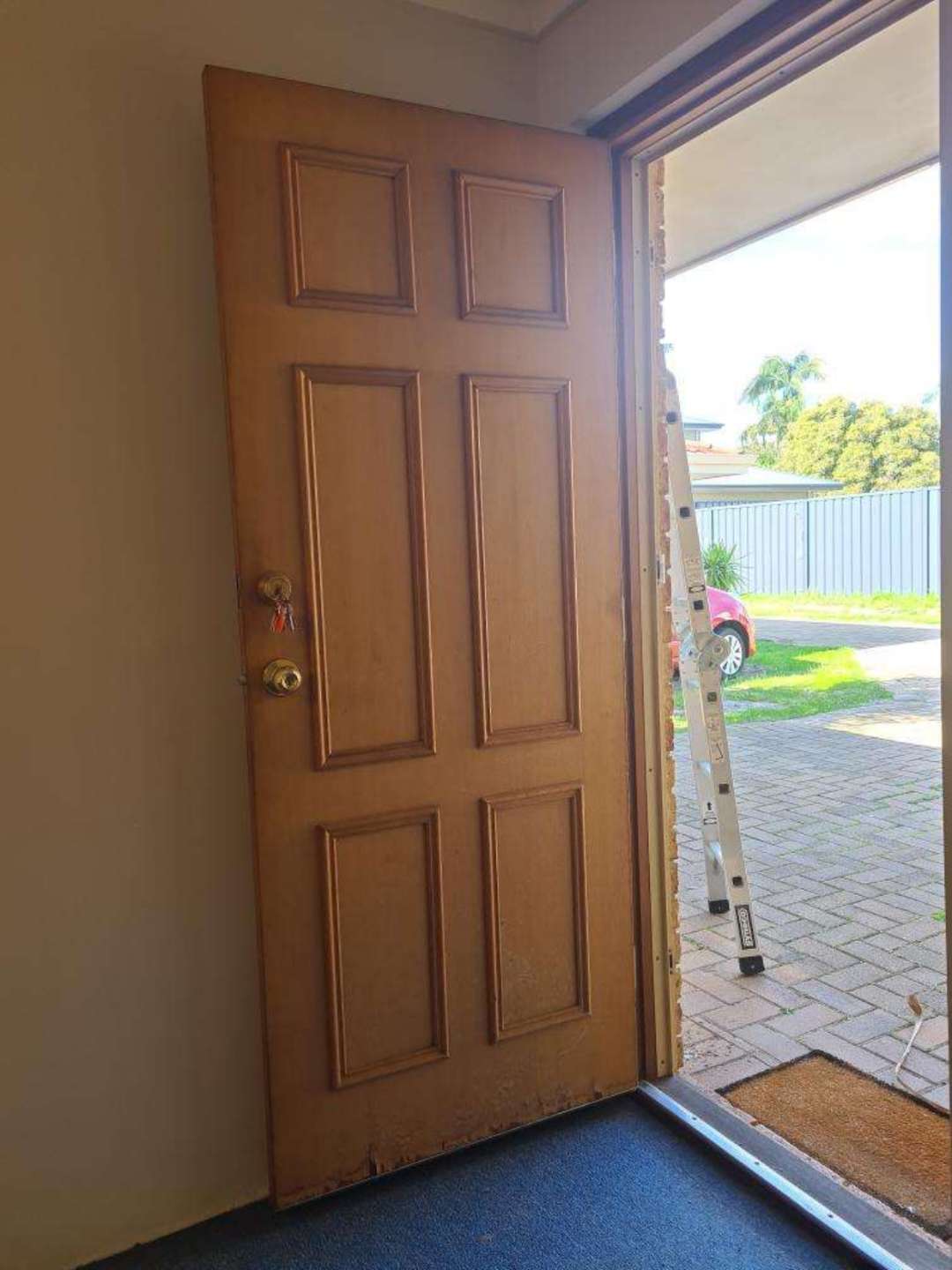 External Doors Moisture Damage — real moisture defect photographed in a SURE Building Inspections report
