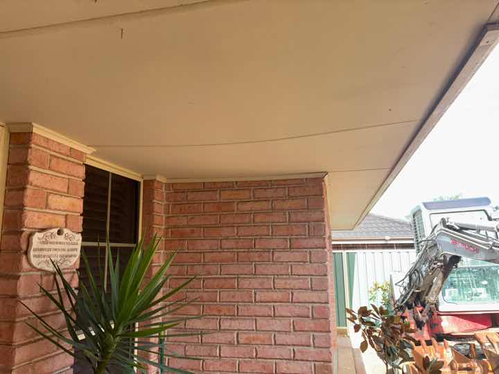 Sagging/Uneven Eave Sections — real structural defect photographed in a SURE Building Inspections report